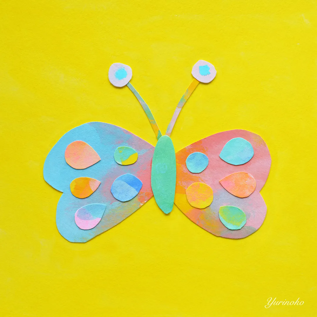 蝶のカラフルでポップな切り絵のイラスト