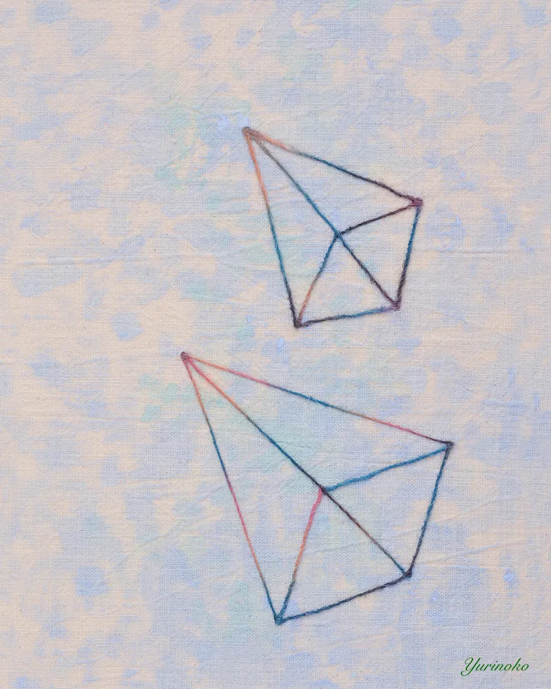 三角形の毛糸の線画の布絵